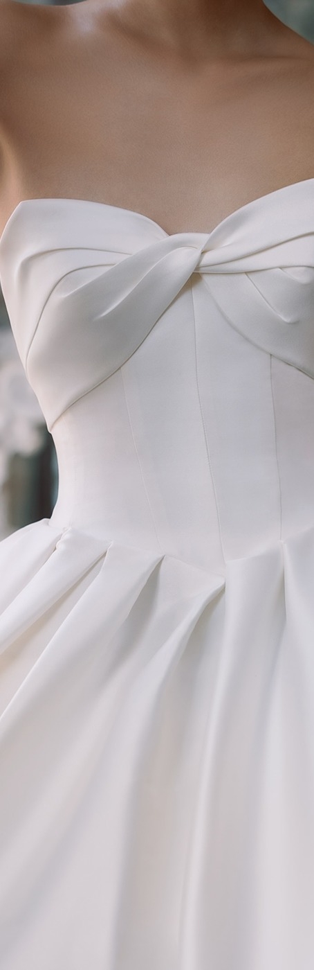 Photo of the model wearing a bridal gown